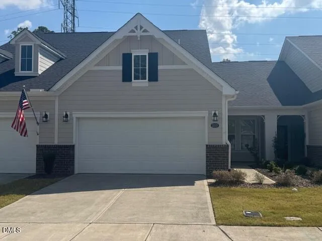 a bathroom with a granite countertop sink mirror and shower