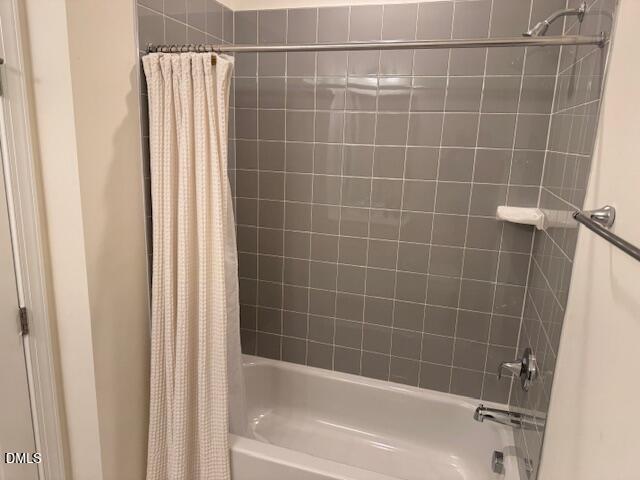 1010 Morrison Drive Durham, NC 27703 - Photo 21 of 29 a bathroom with a bathtub and a shower