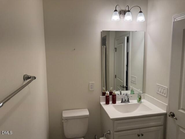 1010 Morrison Drive Durham, NC 27703 - Photo 22 of 29 a bathroom with a sink vanity and toilet