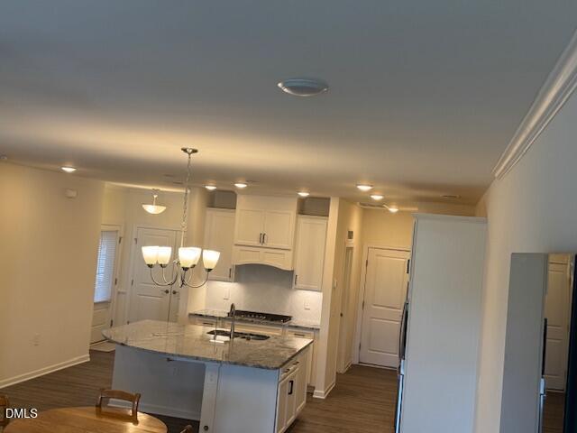 1010 Morrison Drive Durham, NC 27703 - Photo 25 of 29 a kitchen with kitchen island stainless steel appliances a sink and cabinets