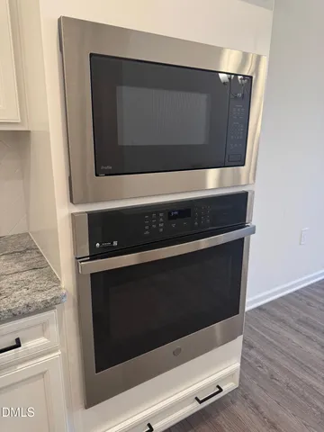 a utility room with wooden floor