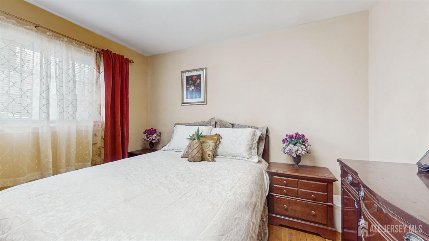 27 Timber Road Edison, NJ 08820 - Photo 12 of 19 a bedroom with a bed and a dresser