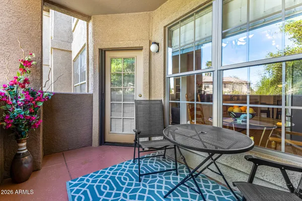 a front view of a house with a yard table and chairs