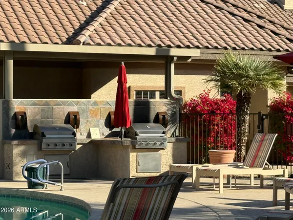 a swimming pool with outdoor seating and yard