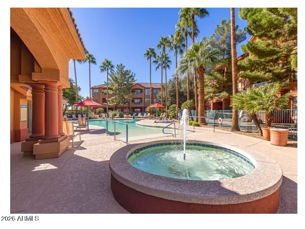 a swimming pool with outdoor seating and yard