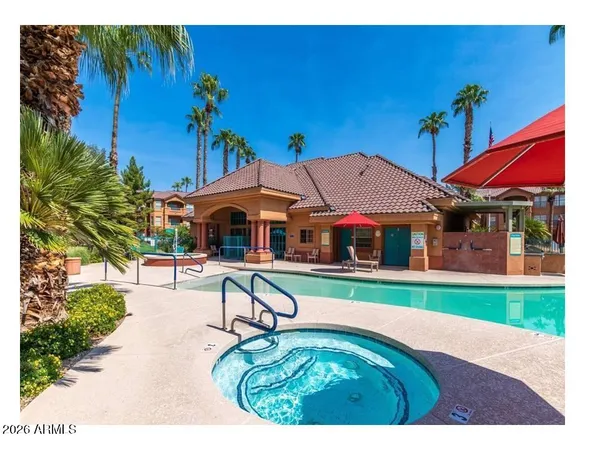 a aerial view of a house with swimming pool garden and patio
