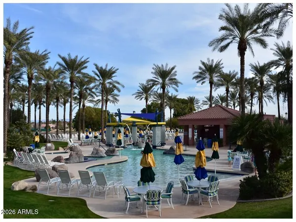 a view of a patio with swimming pool