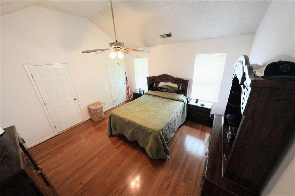7908 Lambert Road Winston, GA 30187 - Photo 12 of 30 a bedroom with a bed window and a table