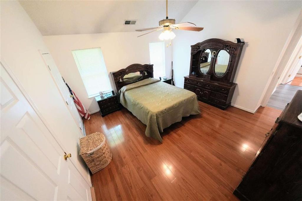 7908 Lambert Road Winston, GA 30187 - Photo 13 of 30 a bedroom with a bed window and a mirror