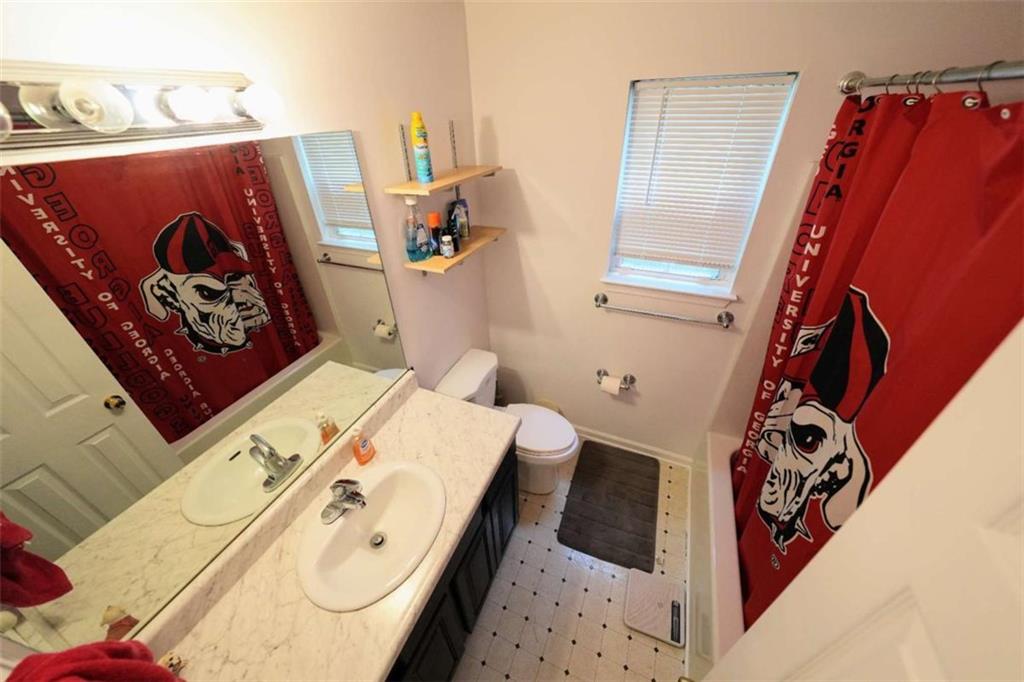 7908 Lambert Road Winston, GA 30187 - Photo 18 of 30 a bathroom with a bathtub and a window