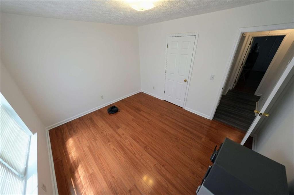 7908 Lambert Road Winston, GA 30187 - Photo 19 of 30 a view of empty room with wooden floor