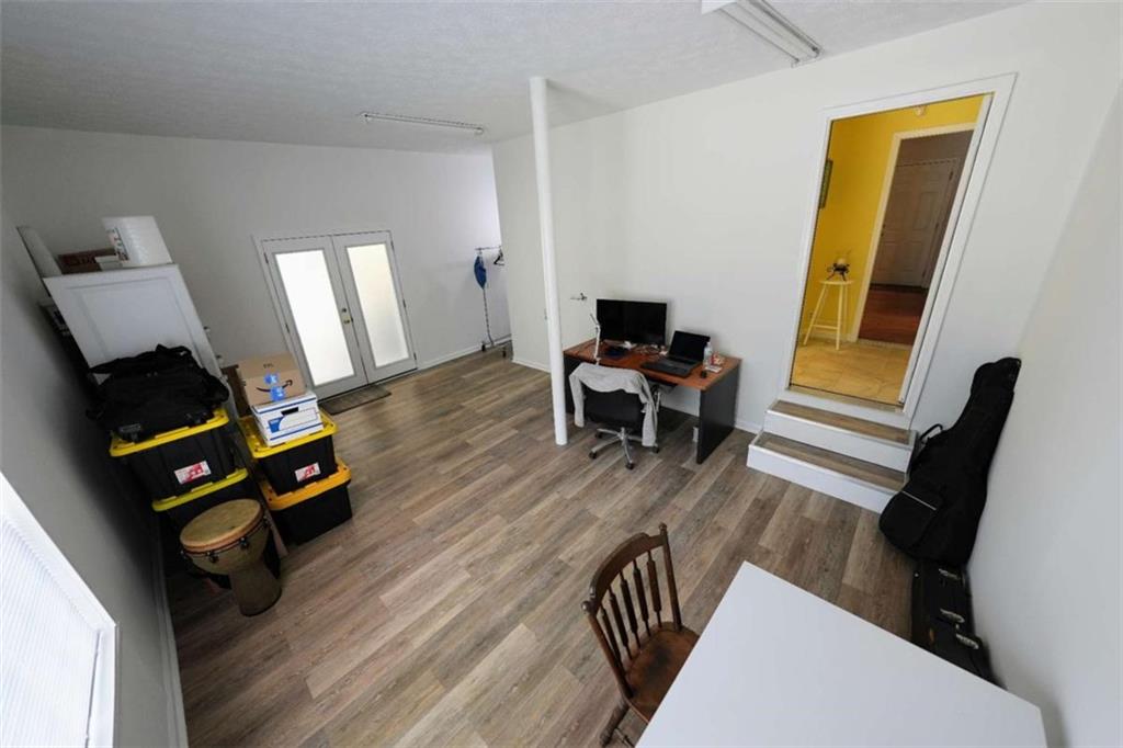 7908 Lambert Road Winston, GA 30187 - Photo 21 of 30 a living room with furniture and a wooden floor