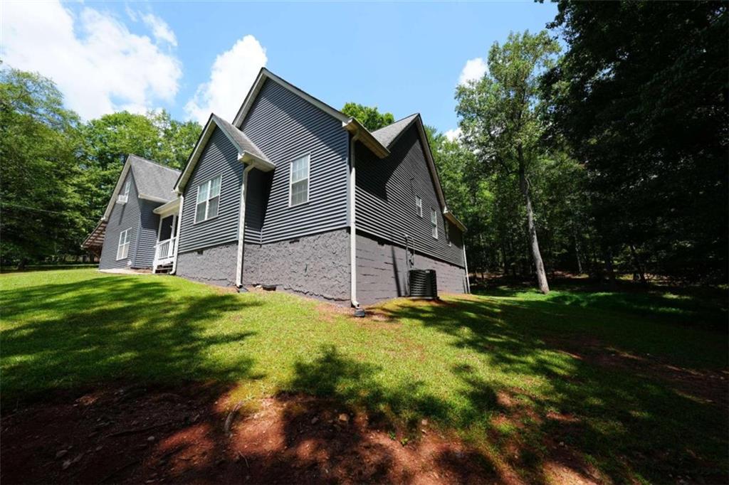 7908 Lambert Road Winston, GA 30187 - Photo 29 of 30 a front view of house with yard and green space