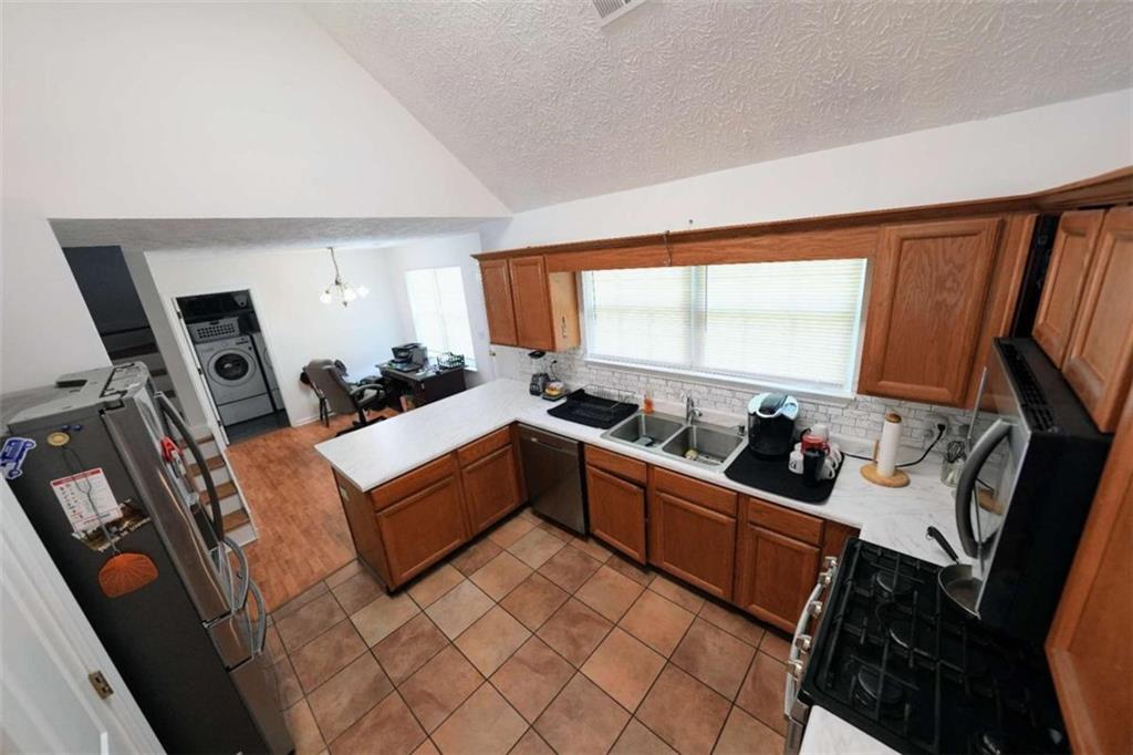 7908 Lambert Road Winston, GA 30187 - Photo 10 of 30 a room with furniture a flat screen tv and a window