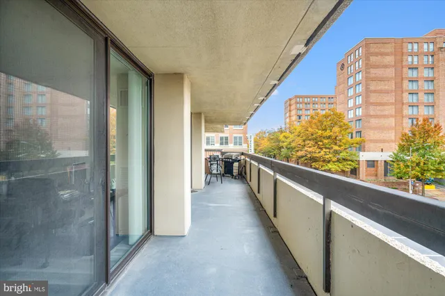 a view of a balcony with furniture