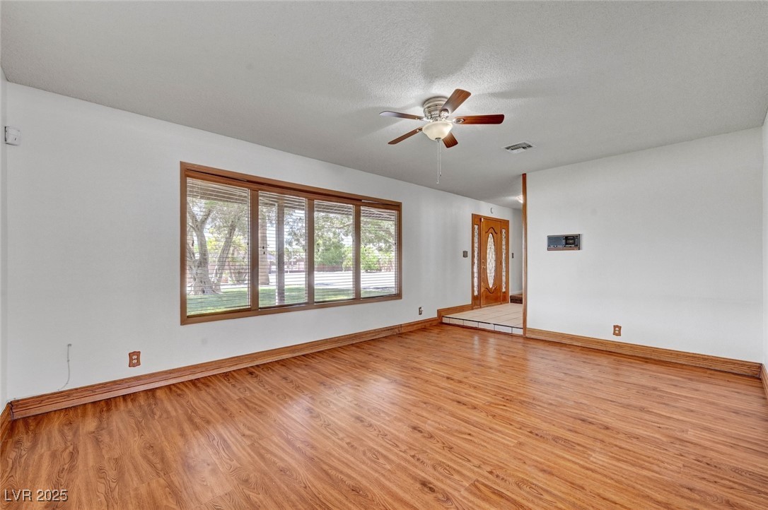 8970 West Lone Mountain Road Las Vegas, NV 89149 - Photo 23 of 94 spacious living room with bay window to the beautiful front yard