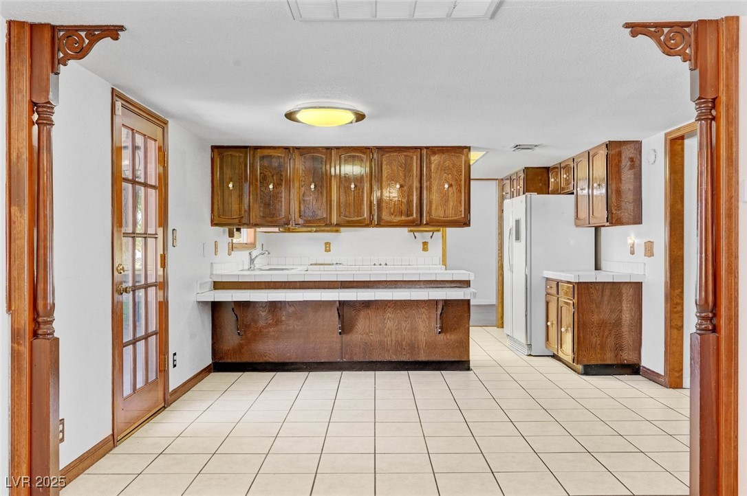 8970 West Lone Mountain Road Las Vegas, NV 89149 - Photo 28 of 94 looking into the eat in kitchen area from the family/great room