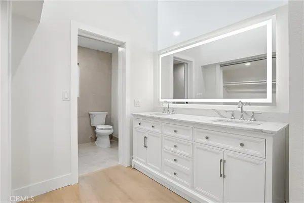 a bathroom with a shower and a glass door