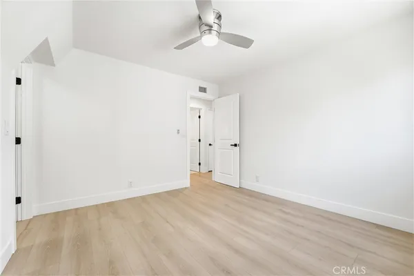 a bathroom with a granite countertop sink a toilet and a bathtub