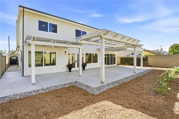 a view of an entryway with flower