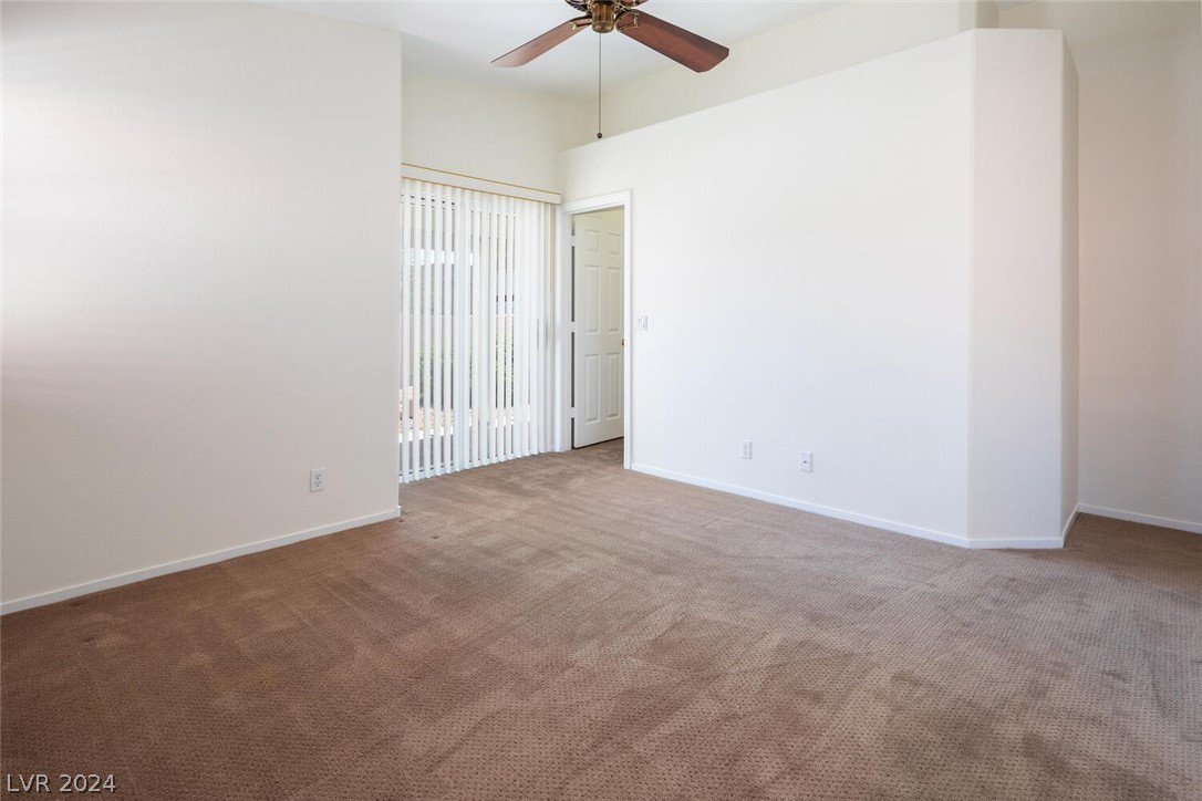 2357 Ramsgate Drive Henderson, NV 89074 - Photo 27 of 38 Spacious primary bedroom with patio access and ens