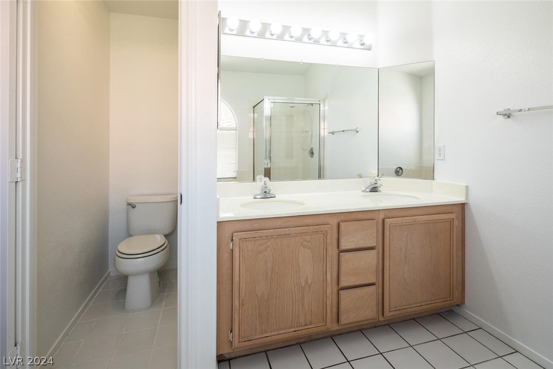 2357 Ramsgate Drive Henderson, NV 89074 - Photo 29 of 38 Spacious primary bedroom with patio access and ens