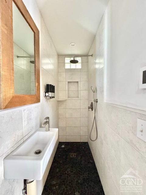 75 Bridge Street Catskill, NY 12414 - Photo 12 of 17 a bathroom with a shower and a sink