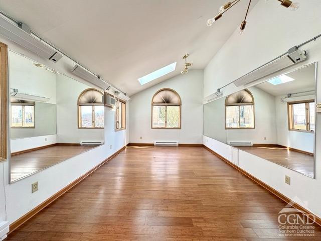 75 Bridge Street Catskill, NY 12414 - Photo 7 of 17 a view of an empty room with window and wooden floor