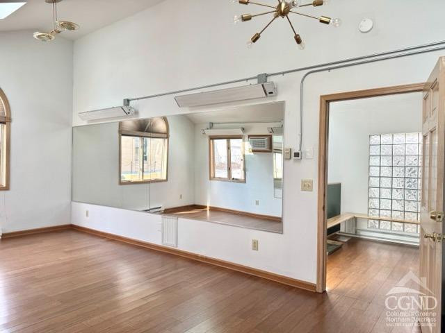 75 Bridge Street Catskill, NY 12414 - Photo 8 of 17 wooden floor in an empty room with a window