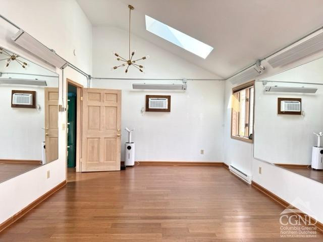 75 Bridge Street Catskill, NY 12414 - Photo 10 of 17 wooden floor in an empty room with a window