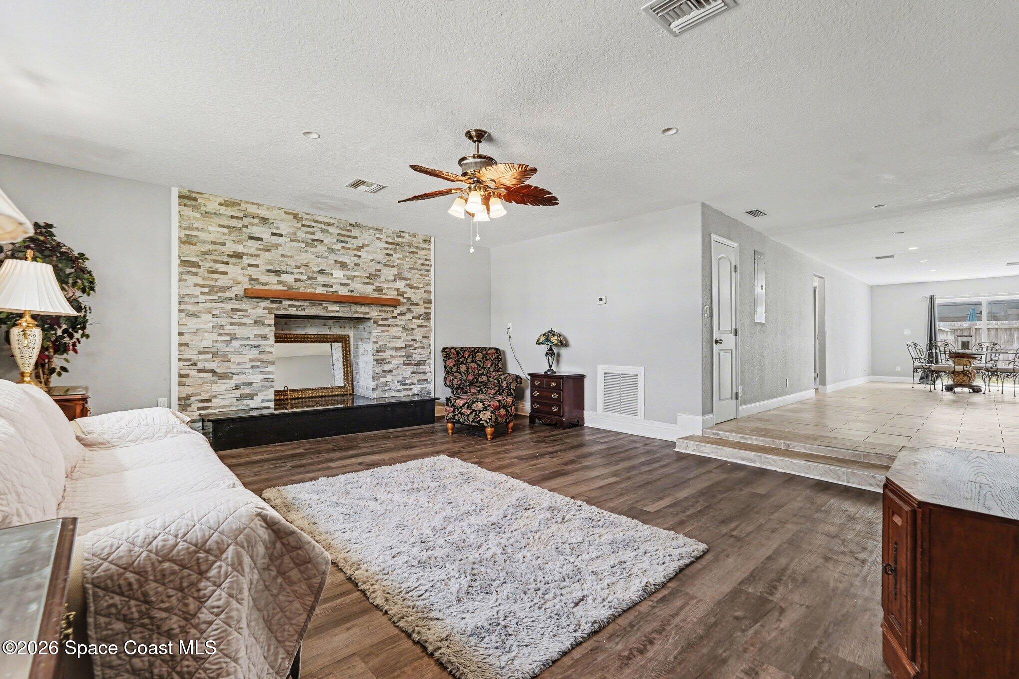 455 Riverside Avenue Merritt Island, FL 32953 - Photo 10 of 28 a living room with fireplace furniture and a fireplace