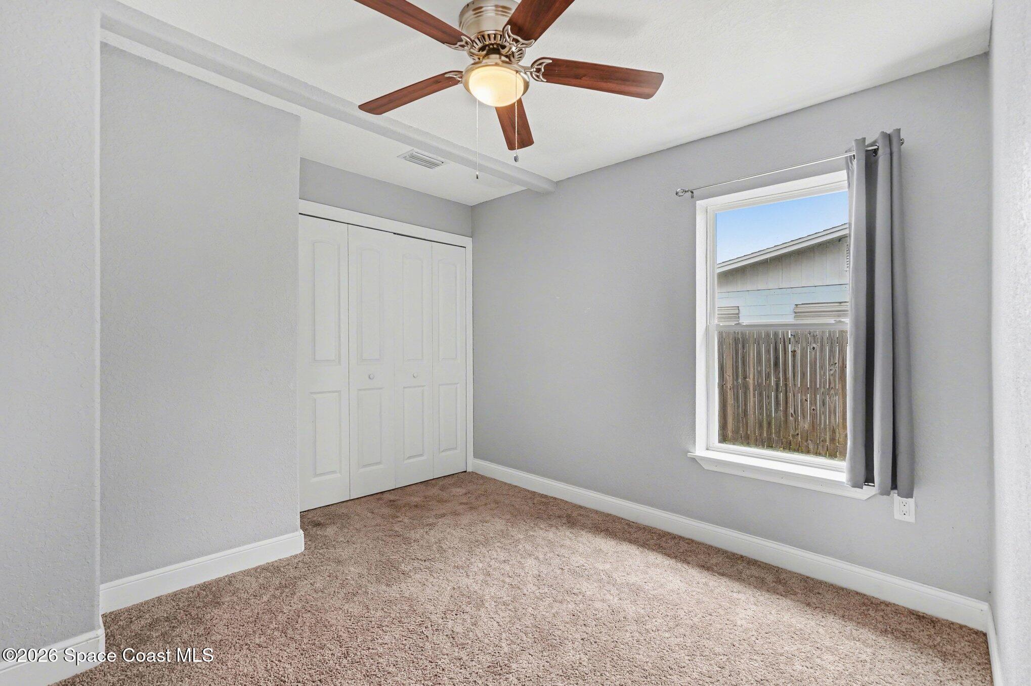 455 Riverside Avenue Merritt Island, FL 32953 - Photo 17 of 28 a view of an empty room with a window