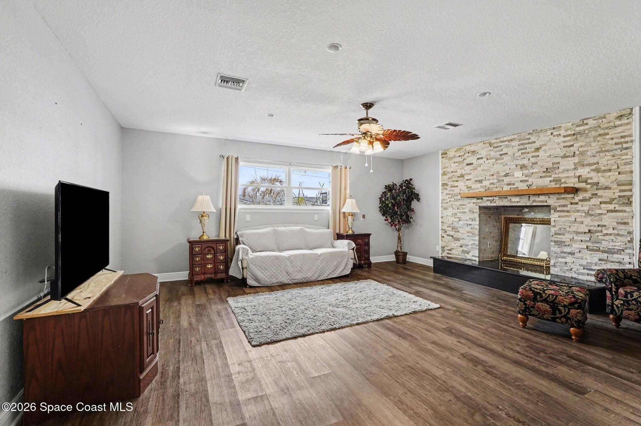 455 Riverside Avenue Merritt Island, FL 32953 - Photo 3 of 28 a living room with furniture and a fireplace