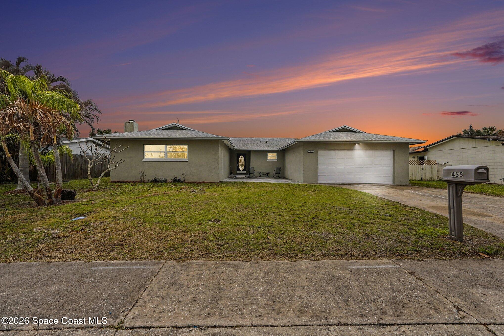 455 Riverside Avenue Merritt Island, FL 32953 - Photo 4 of 28 a front view of a house with garden