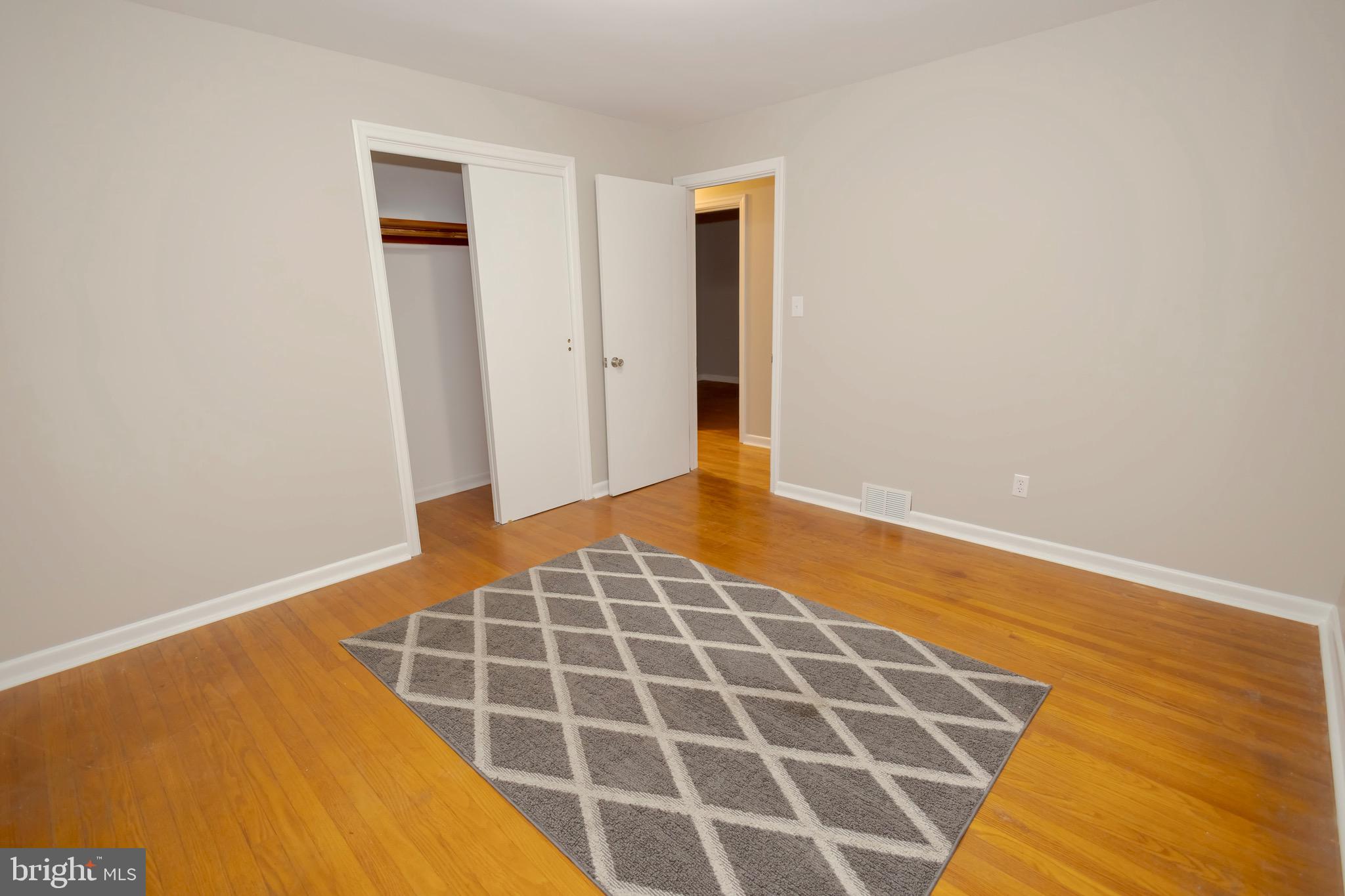 4545 Bill Moxley Road Mount Airy, MD 21771 - Photo 15 of 33 a view of an empty room with wooden floor