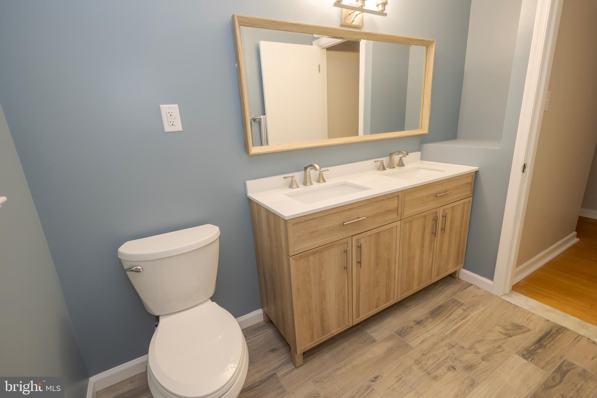 4545 Bill Moxley Road Mount Airy, MD 21771 - Photo 18 of 33 a bathroom with a toilet sink and mirror