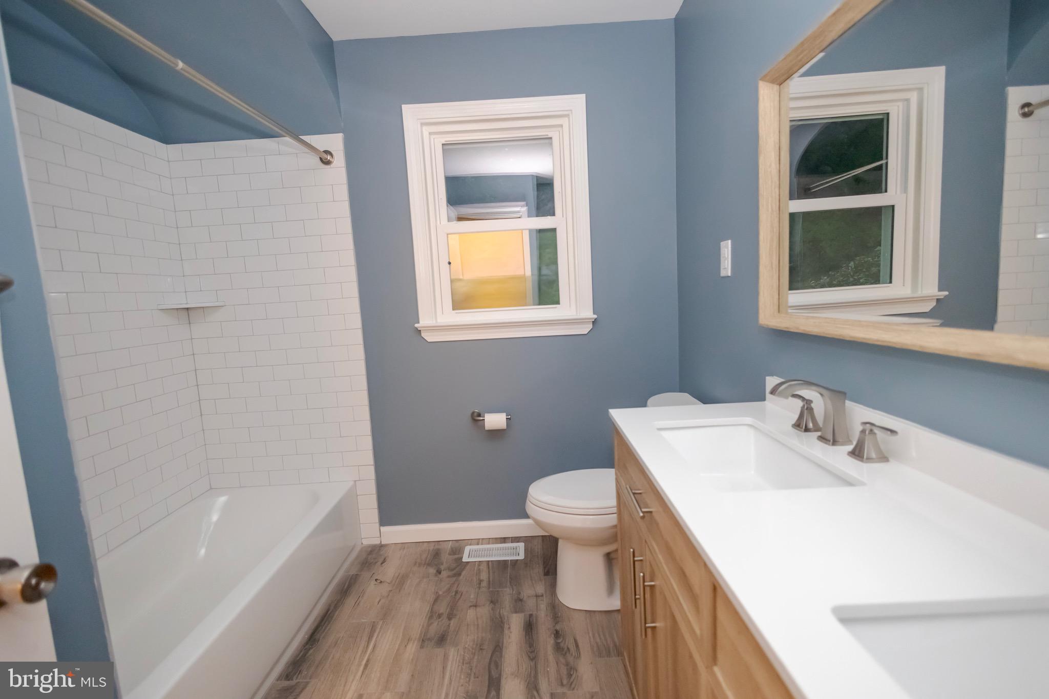 4545 Bill Moxley Road Mount Airy, MD 21771 - Photo 2 of 33 a bathroom with a sink toilet and shower