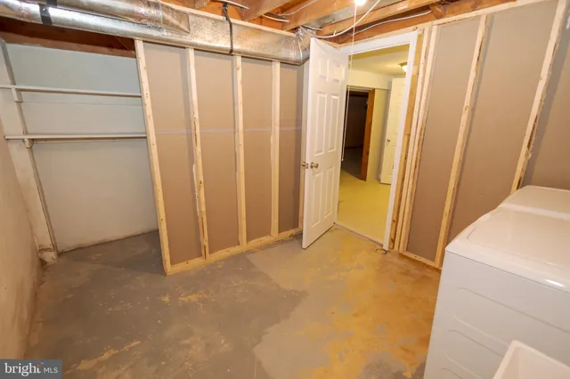 an aerial view of a house with swimming pool and outdoor seating