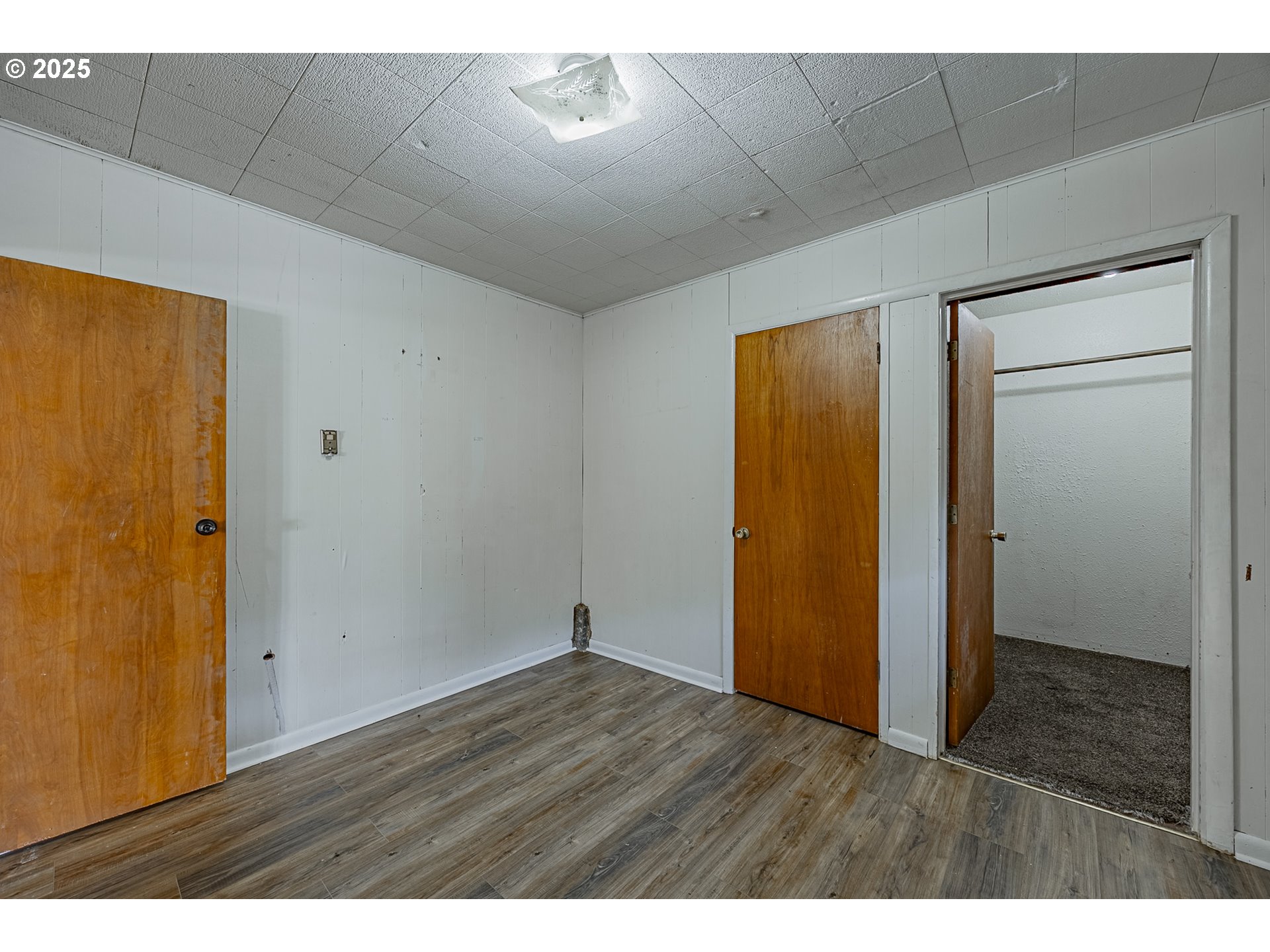 1860 Meade Avenue North Bend, OR 97459 - Photo 23 of 38 a view of an empty room with wooden floor