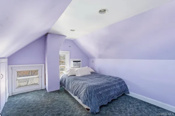 a bedroom with a bed and a cabinets