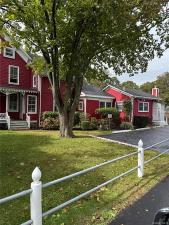 a front view of a building with garden