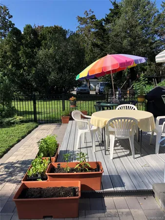 an outdoor space with furniture and umbrella