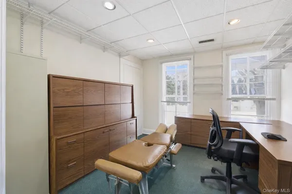 a workspace with furniture and a window