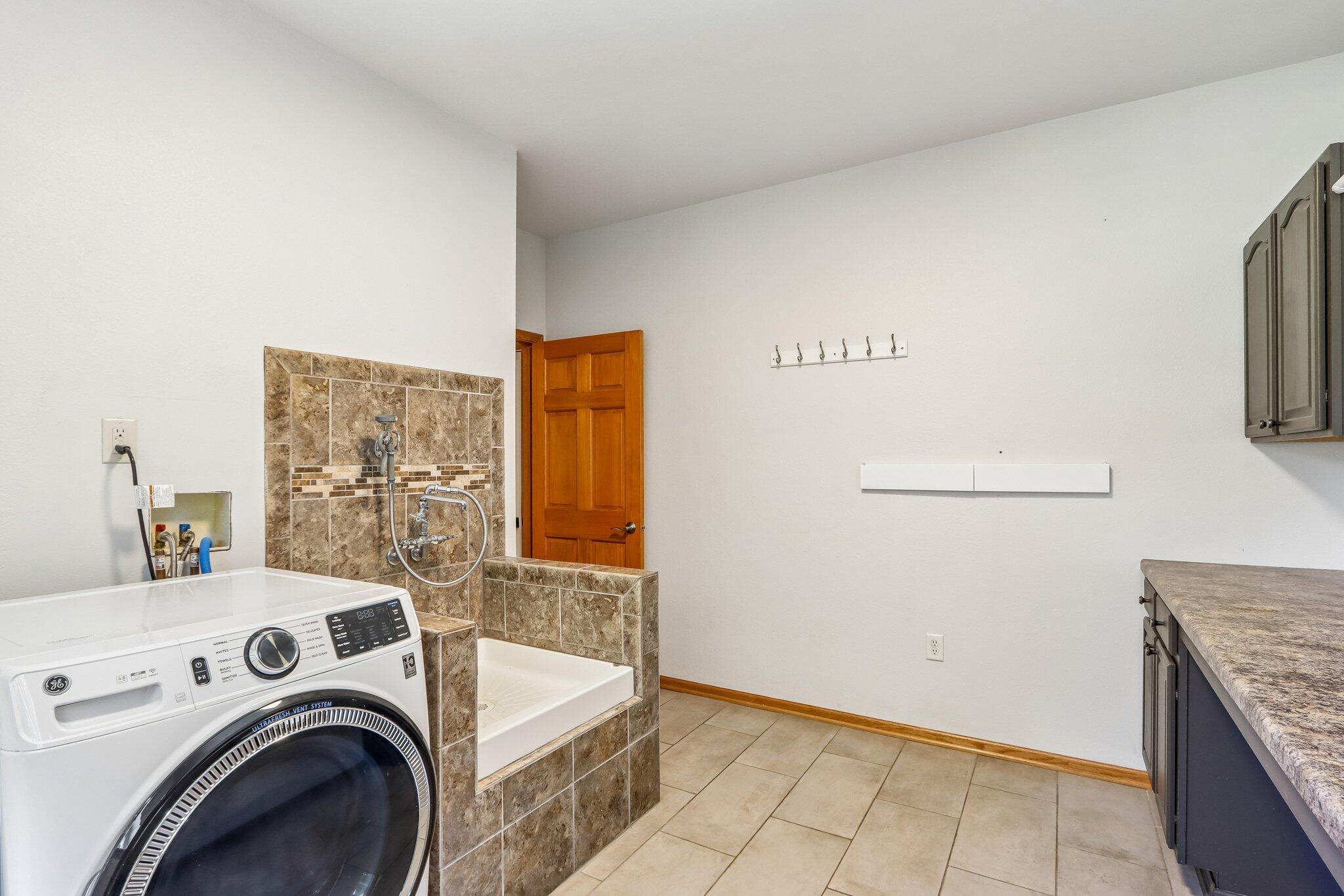 2335 Forest Run Summit, WI 53066 - Photo 19 of 60 Laundry Room w/ Dog Wash
