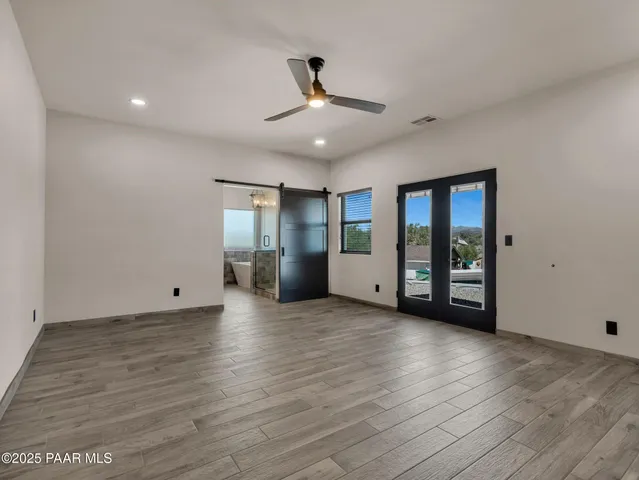 a bathroom with a shower and a mirror