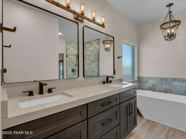 a bathroom with a bathtub and shower