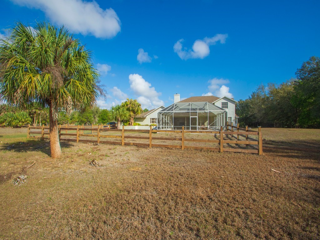 167 Deer Run Road Palm Bay, FL 32909 - Photo 32 of 35 a front view of a house with a yard