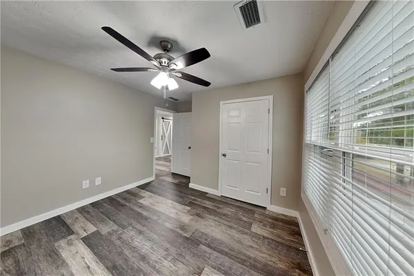 a view of an empty room with a window