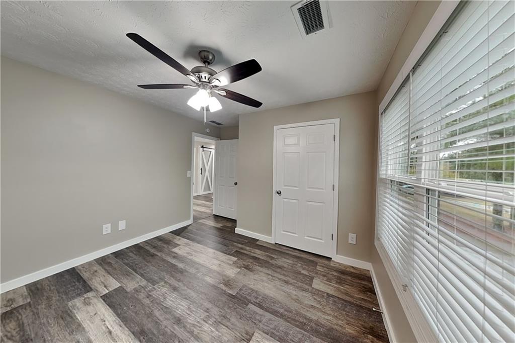 6072 Devonshire Drive Flowery Branch, GA 30542 - Photo 12 of 22 a view of an empty room with a window