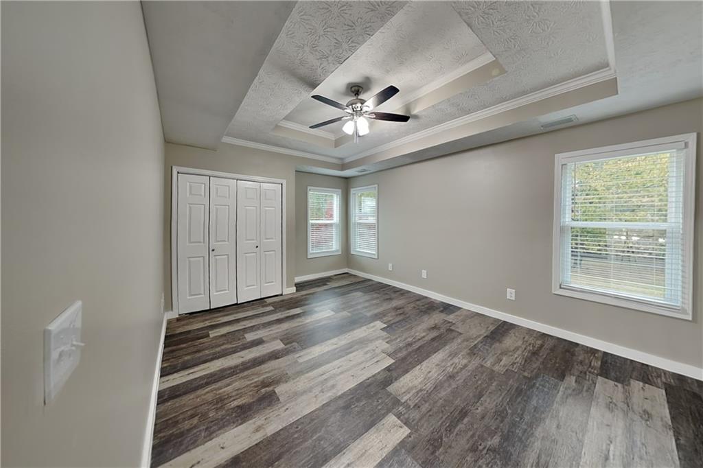 6072 Devonshire Drive Flowery Branch, GA 30542 - Photo 16 of 22 a view of an empty room with a window